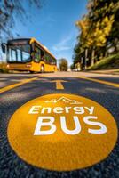 View of the energy bus lane signage with bus approaching on a sunny afternoon in a city photo