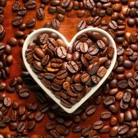 Coffee beans in a white, heart-shaped ceramic cup are placed among many coffee beans. Images that express the love of coffee Intense fragrance and the feeling of comfort it gives to coffee lovers. photo