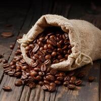 Dark brown coffee beans being poured out of a sack on a wooden background. This image conveys the freshness and aroma of the coffee beans. photo
