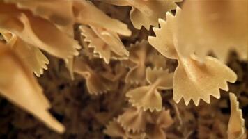 Farfale pasta falls down. Filmed on a high-speed camera at 1000 fps. High quality FullHD footage video