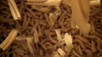 The pasta casarecce falls down. Filmed on a high-speed camera at 1000 fps. High quality FullHD footage video
