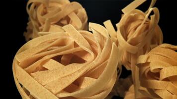The tagliatelle pasta flies up. Filmed on a high-speed camera at 1000 fps. High quality FullHD footage video