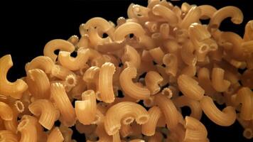 The dry pasta flies up and falls down. Filmed on a high-speed camera at 1000 fps. High quality FullHD footage video
