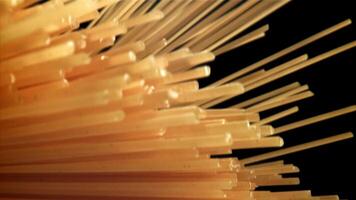 Spaghetti pasta flies up and falls down. Filmed on a high-speed camera at 1000 fps. High quality FullHD footage video