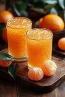 Homemade mandarin orange marmalade in a jar with fresh fruit on a wooden table photo