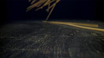 Spaghetti falls on the table. Filmed on a high-speed camera at 1000 fps. High quality FullHD footage video