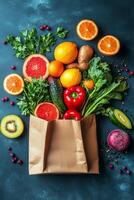 Fresh produce assortment in a brown paper bag on a textured black surface photo