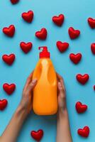 Cleaning red heart decorations with blue gloves on a textured surface photo