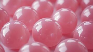 Close-up of pink gel balls arranged neatly on a soft surface photo
