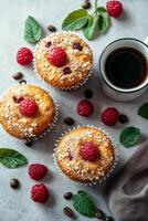 Freshly baked raspberry muffins with oats displayed on a plate surrounded by coffee photo