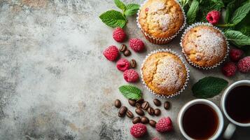 Freshly baked raspberry muffins with a cup of coffee on a textured surface photo