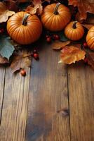 Orange pumpkins surrounded by autumn leaves and berries on a rustic wooden surface photo