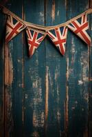 Decorative Union Jack bunting hanging on a rustic blue wooden wall for a festive atmosphere photo