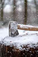 An ax rests on a snowy tree stump surrounded by a tranquil winter forest scene photo