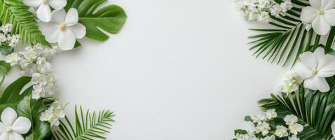 Vibrant tropical flowers and leaves arranged artistically on a neutral background photo