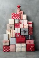 A festive arrangement of colorful wrapped gifts stacked in the shape of a Christmas tree photo