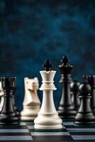 A close-up view of a white chess king surrounded by black chess pieces on a dark background photo
