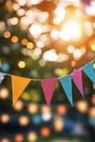 Colorful festive bunting adorned with lights in a park during a warm summer evening photo