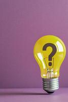 Yellow light bulb with question mark on purple background representing creativity and ideas photo
