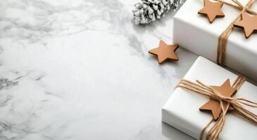 Celebratory wrapped gifts with stars and decorative elements on a marble surface photo