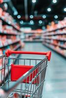Shopping cart in a grocery store aisle filled with colorful product packages during the day photo