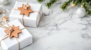 Celebratory wrapped gifts with stars and decorative elements on a marble surface photo