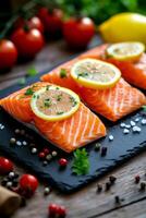 Fresh salmon fillets garnished with lemon slices and herbs on a rustic wooden table photo