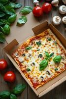 Delicious cheese pizza topped with mushrooms and fresh basil in a takeout box on wooden table photo
