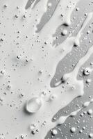 Smooth white cream with bubbles and swirls on a textured surface in soft lighting photo