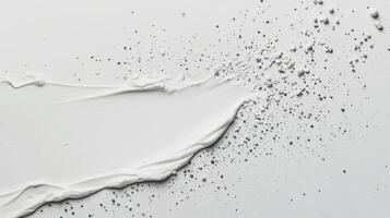 Smooth white cream flowing across a flat surface with bubbles and droplets captured in detail photo