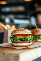 Delicious sesame seed burger with lettuce, tomato, and fries in a casual dining setting photo