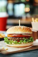 Delicious sesame seed burger with lettuce, tomato, and fries in a casual dining setting photo
