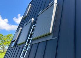 Installation of a solar-powered remote control electrical system on the skylight. photo