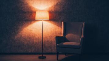 Cozy armchair beside a warm lamp in a softly lit room during evening hours photo