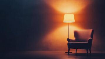 Cozy armchair beside a warm lamp in a softly lit room during evening hours photo