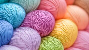 Colorful skeins of yarn stacked together in vibrant shades for crafting projects during daylight photo