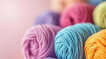 Colorful skeins of yarn stacked together in vibrant shades for crafting projects during daylight photo