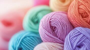 Colorful skeins of yarn stacked together in vibrant shades for crafting projects during daylight photo