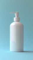 Simple white pump bottle on a light blue background for cosmetic or skincare products photo