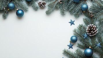 Elegant holiday decorations with blue ornaments and pine branches on a dark background photo