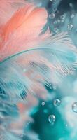 Delicate pink feathers gently float in a shimmering blue background with soft bubbles photo