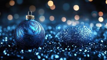 Elegant holiday decorations with blue ornaments and pine branches on a dark background photo
