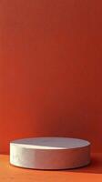 Minimalist display platform with orange geometric shapes and gradient background in modern art style photo