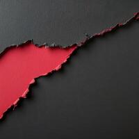 Torn red paper revealing a dark textured background with a creative contrast photo