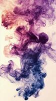Colorful smoke swirling in dynamic patterns against a light background photo