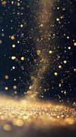 Golden particles dancing in the air against a dark background create a magical atmosphere photo