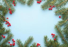 Festive wreath made of evergreen branches and red berries on a light blue background photo