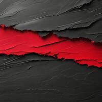 Torn red paper revealing a dark textured background with a creative contrast photo