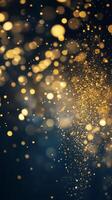 Golden particles dancing in the air against a dark background create a magical atmosphere photo