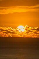 Beautiful golden sunset over the ocean, Mahe Seychelles photo